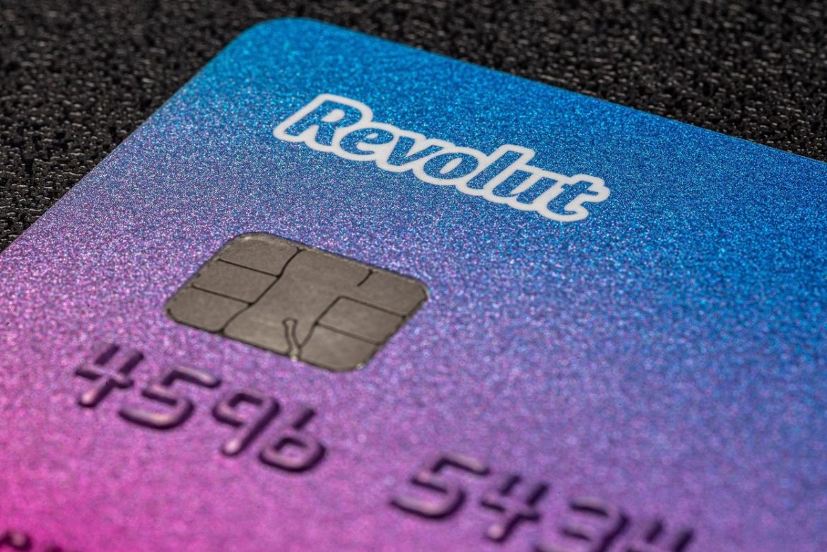 Bonn, Germany June 15, 2020. Payment card belonging to the Revolut electronic bank on a black background, macro shot, mobile banking.